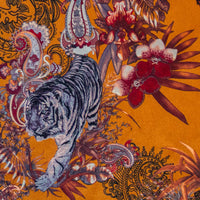 Detail of the Bengal tiger on orange yellow Indian wildlife print velvet furnishing fabric