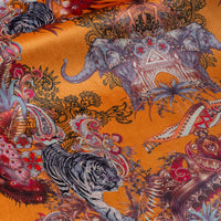 Close-up of Bengal Tiger, elephant and paisley detailing on Magic Of India Indian wildlife print velvet fabric in orange yellow