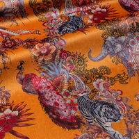 Magic Of India orange yellow Indian wildlife print designer velvet fabric by Becca Who, with a peacock, Bengal tigers and elephants with paisley detailing