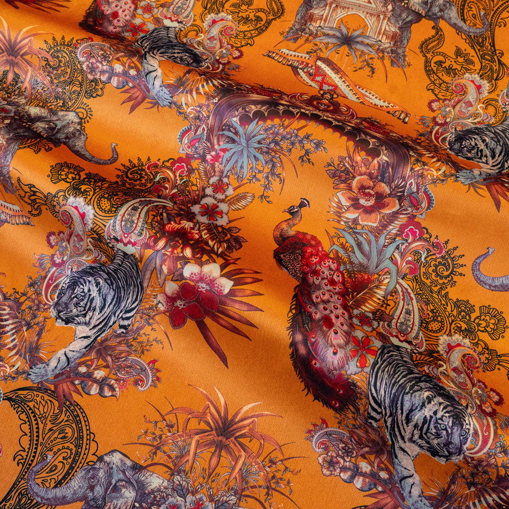 Magic Of India orange yellow velvet fabric draped in soft folds, showing how the Indian wildlife print falls for curtains and blinds