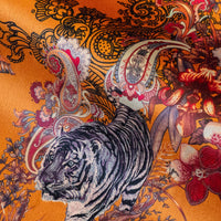 Magic Of India velvet fabric in orange yellow photographed at an angle to show the subtle sheen