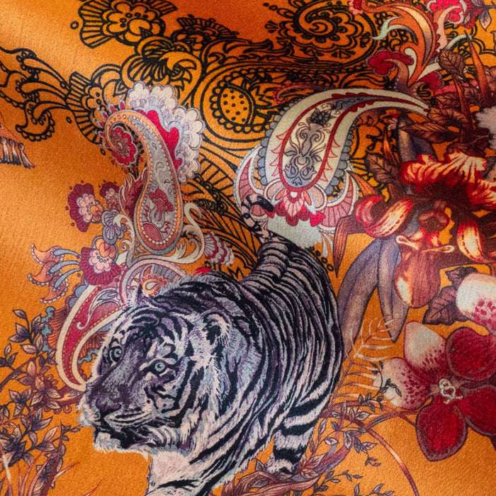 Magic Of India velvet fabric in orange yellow photographed at an angle to show the subtle sheen