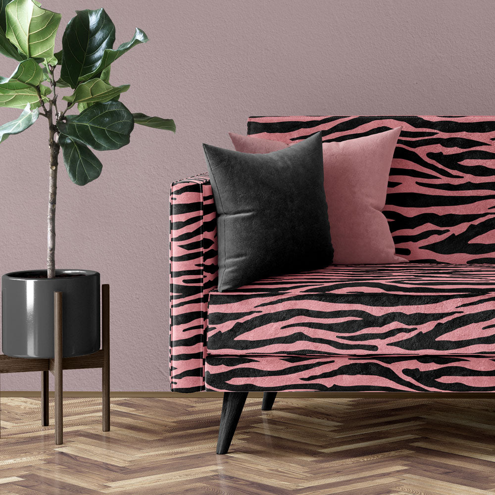Pink & Black Animal Print Zebra Furnishing Fabric on upholstered sofa by Designer, Becca Who