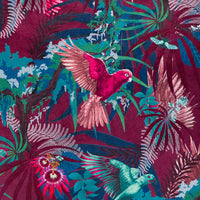 Detail of the intertwined wings and flowers on hot pink and claret tropical bird print velvet furnishing fabric