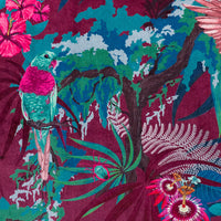 Close-up of the perched tropical bird and flowers on Rainforest Rush hot pink and claret patterned velvet upholstery fabric