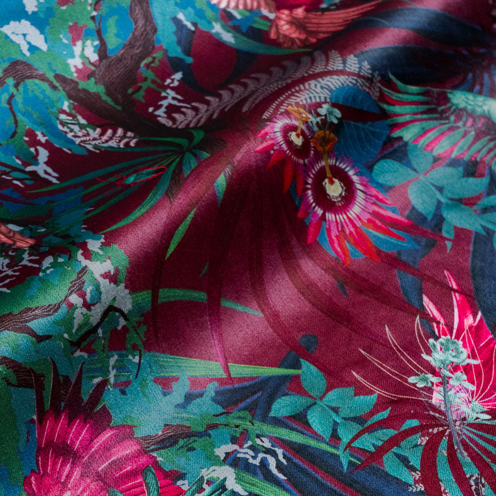 Rainforest Rush velvet fabric in hot pink and claret photographed at an angle to show the subtle sheen