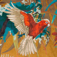 Close-up of Macaw bird in flight on Rainforest Rush tropical bird print velvet fabric in mustard yellow