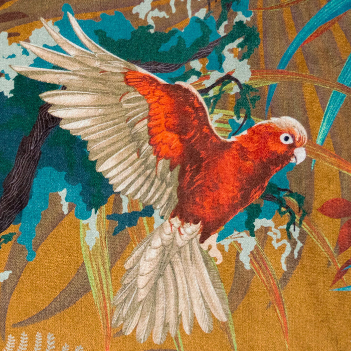 Close-up of Macaw bird in flight on Rainforest Rush tropical bird print velvet fabric in mustard yellow