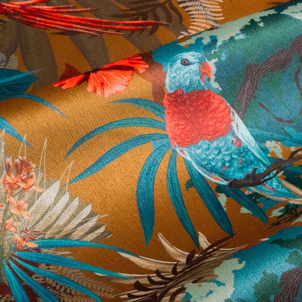 Close-up of perched Macaw bird on Rainforest Rush tropical bird print velvet fabric in mustard yellow