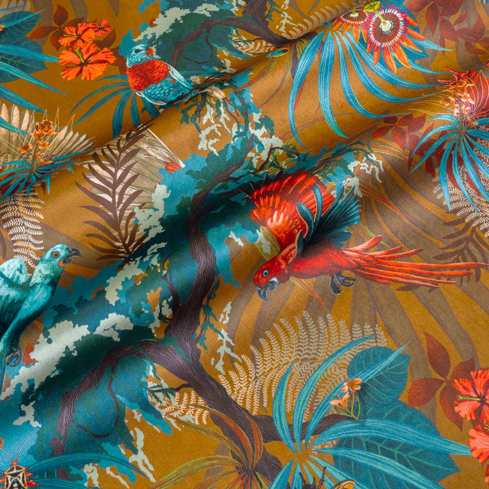 Rainforest Rush mustard yellow velvet fabric draped in soft folds, showing how the tropical bird print falls for curtains and blinds