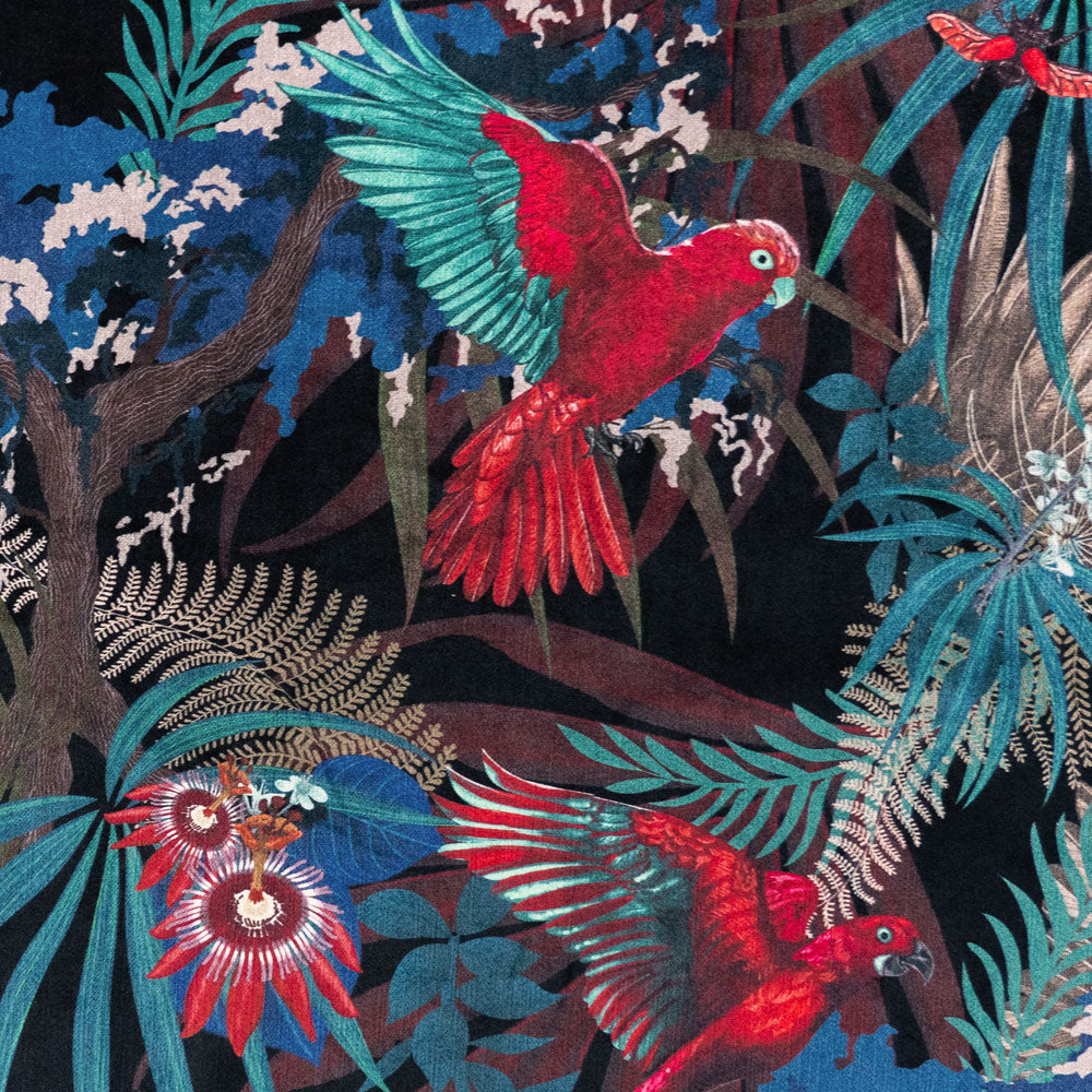 Close-up of birds and foliage on Rainforest Rush tropical bird print velvet fabric in black red and gold