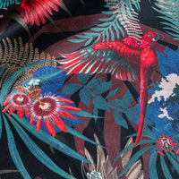 Close-up of the tropical bird on Rainforest Rush black red and gold patterned velvet upholstery fabric
