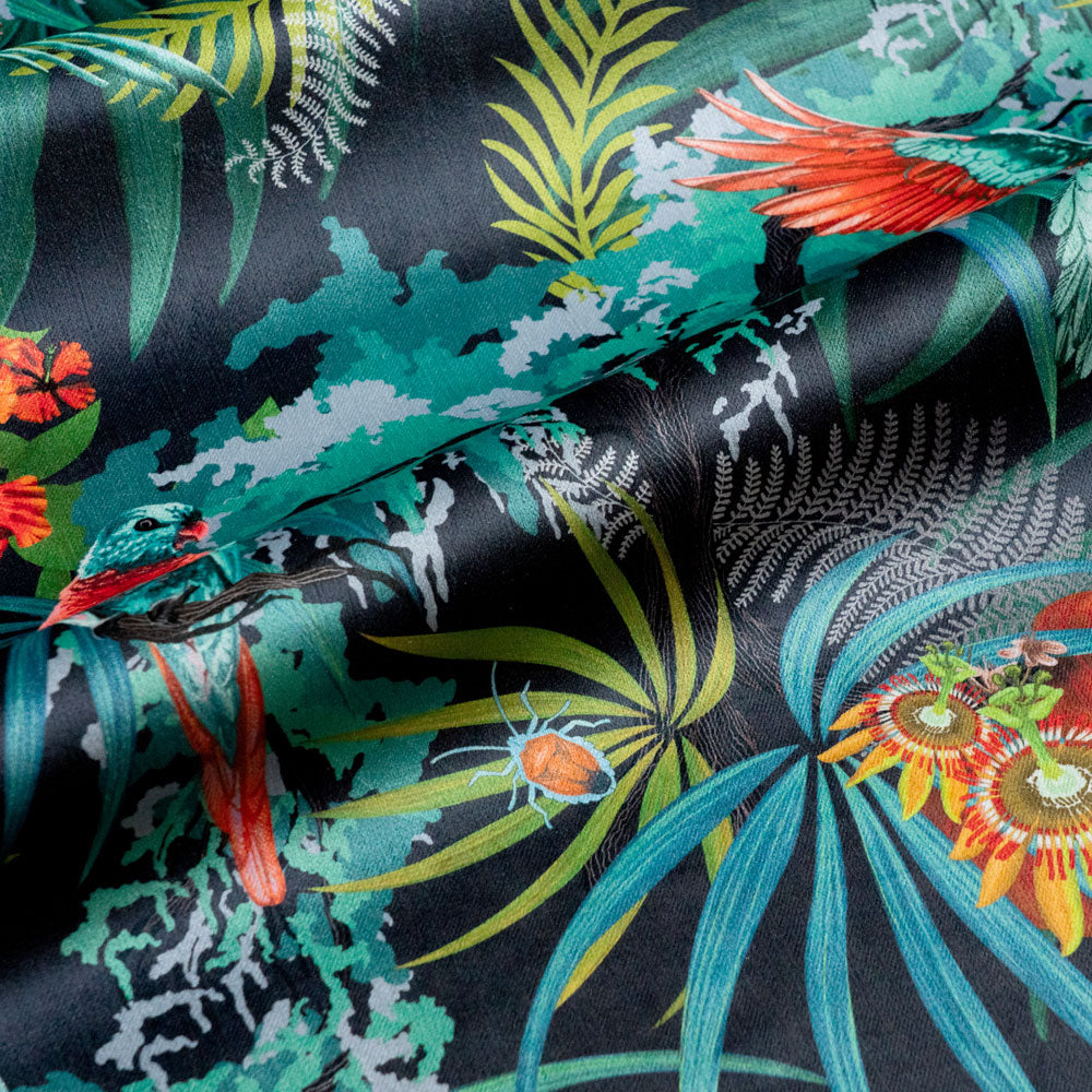 Close-up of exotic bugs and foliage on Rainforest Rush tropical bird print velvet fabric in colourful