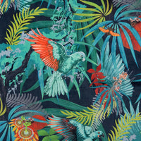 Detail of the Macaw wings and flowers on colourful tropical bird print velvet furnishing fabric
