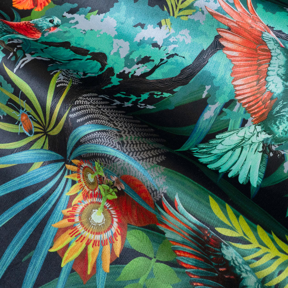 Rippled lengths of Rainforest Rush colourful tropical bird print velvet fabric for upholstery and cushions