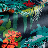 Rainforest Rush colourful velvet fabric draped in soft folds, showing how the tropical bird print falls for curtains and blinds
