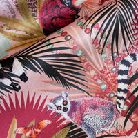 Close-up of the lemur on Treetop Tango dawn pink patterned velvet upholstery fabric