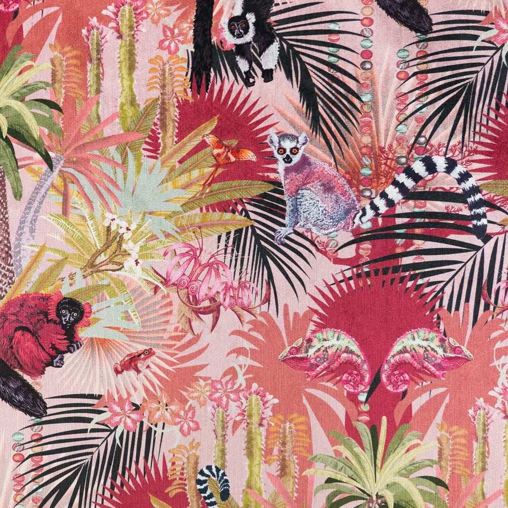 Close-up of lemurs, chameleons and comet moth with agate bead strands on Treetop Tango lemur print velvet fabric in dawn pink