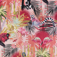 Close-up of lemurs, chameleons and comet moth with agate bead strands on Treetop Tango lemur print velvet fabric in dawn pink