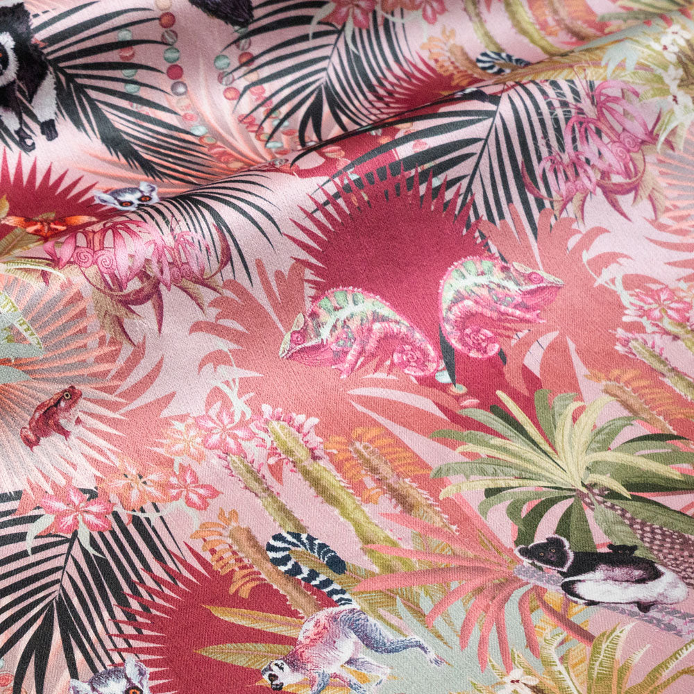 Treetop Tango dawn pink velvet fabric draped in soft folds, showing how the lemur print falls for curtains and blinds