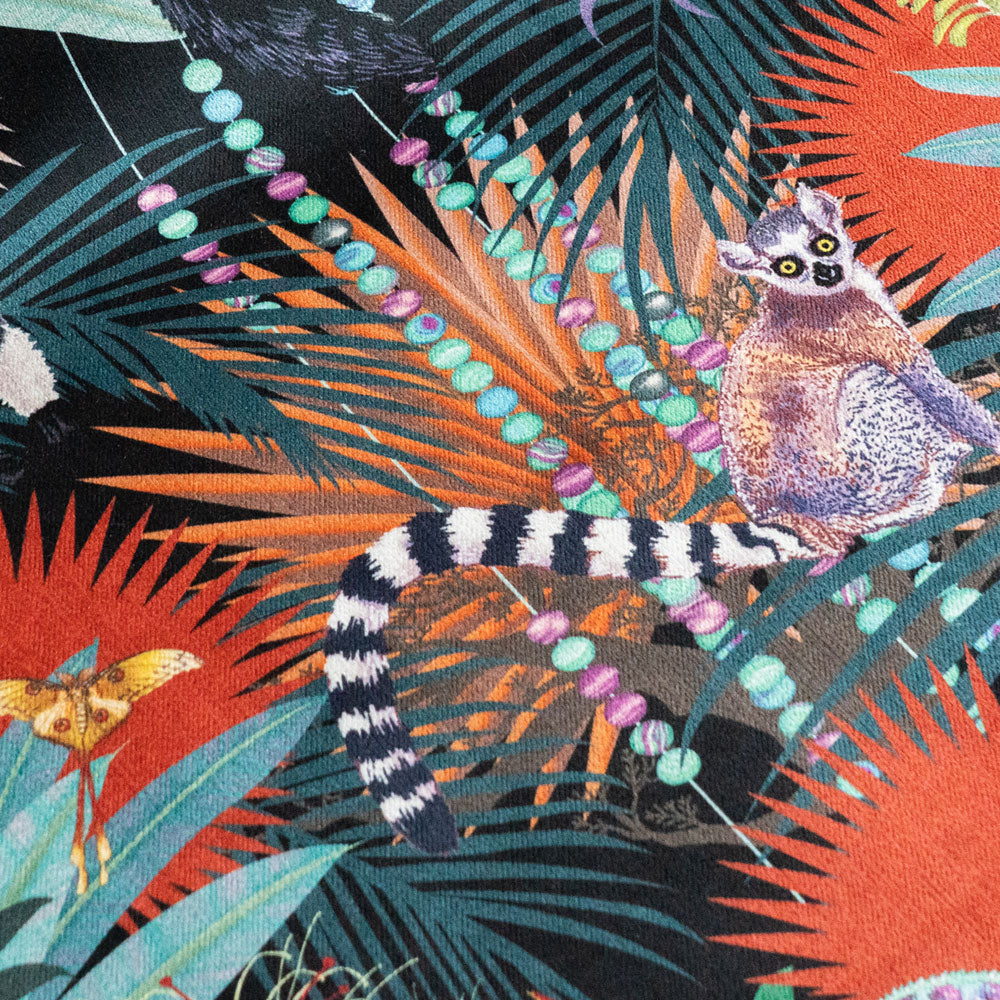 Close-up of the ring-tailed lemur on Treetop Tango dark colourful patterned velvet upholstery fabric