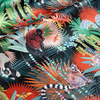 Treetop Tango dark colourful velvet fabric draped in soft folds, showing how the lemur print falls for curtains and blinds