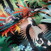 Treetop Tango velvet fabric in dark colourful photographed at an angle to show the subtle sheen