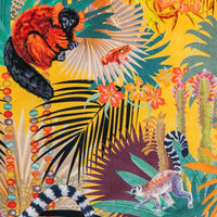 Close-up of lemurs, tomato frog and agate bead strands on Treetop Tango lemur print velvet fabric in sunshine yellow