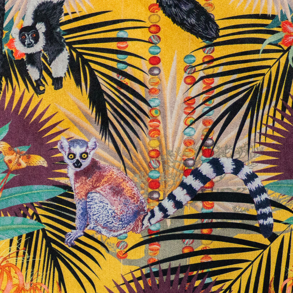 Close-up of the ring-tailed lemur on Treetop Tango sunshine yellow patterned velvet upholstery fabric