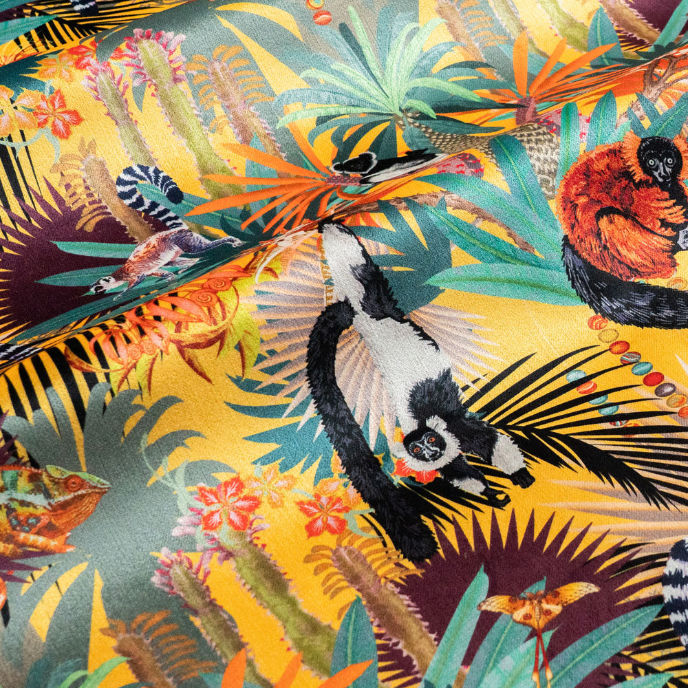 Treetop Tango sunshine yellow velvet fabric draped in soft folds, showing how the lemur print falls for curtains and blinds