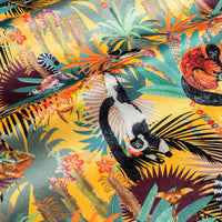 Treetop Tango sunshine yellow velvet fabric draped in soft folds, showing how the lemur print falls for curtains and blinds