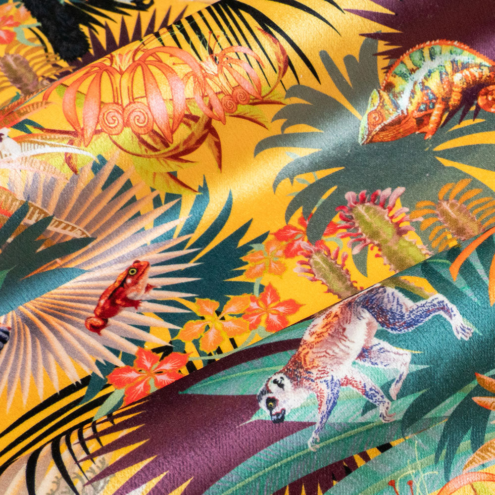 Close up of the soft velvet pile and fine print detail on sunshine yellow lemur print fabric