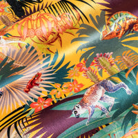 Close up of the soft velvet pile and fine print detail on sunshine yellow lemur print fabric
