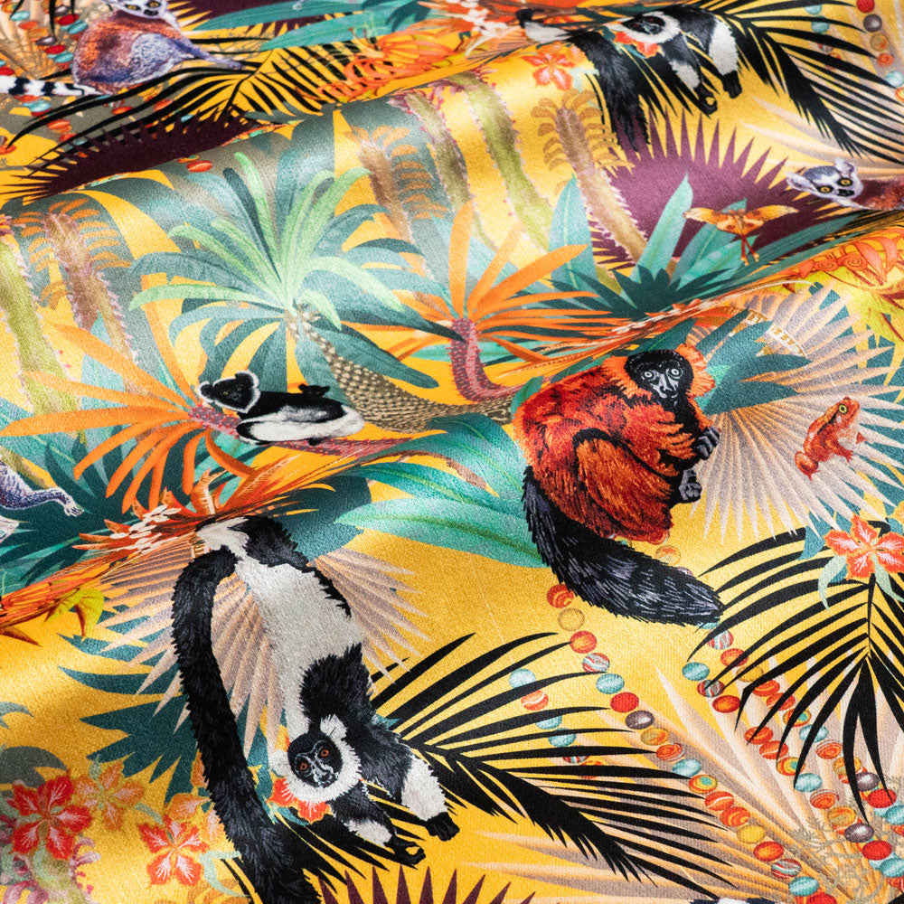 Treetop Tango velvet fabric in sunshine yellow photographed at an angle to show the subtle sheen