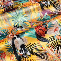Treetop Tango velvet fabric in sunshine yellow photographed at an angle to show the subtle sheen