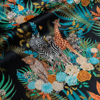 Wild Blooms black African animal and floral print designer velvet fabric by Becca Who, with leopards, zebras and giraffes among blooming flowers