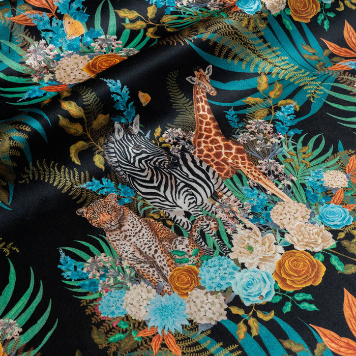 Wild Blooms black African animal and floral print designer velvet fabric by Becca Who, with leopards, zebras and giraffes among blooming flowers