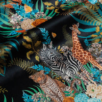 Rippled lengths of Wild Blooms black African animal and floral print velvet fabric for upholstery and cushions