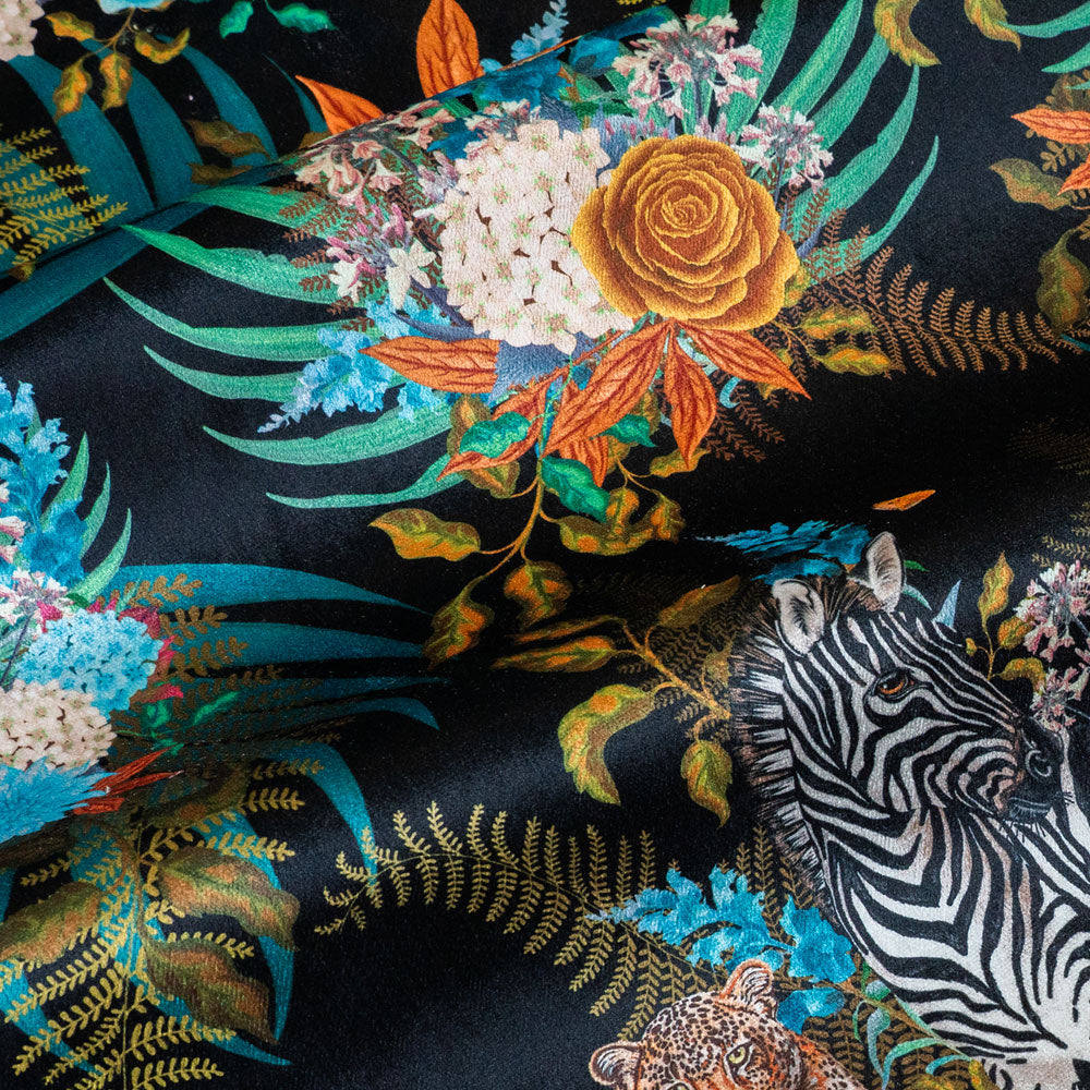 Velvet pile and fine print detail on African animal and floral print fabric on black