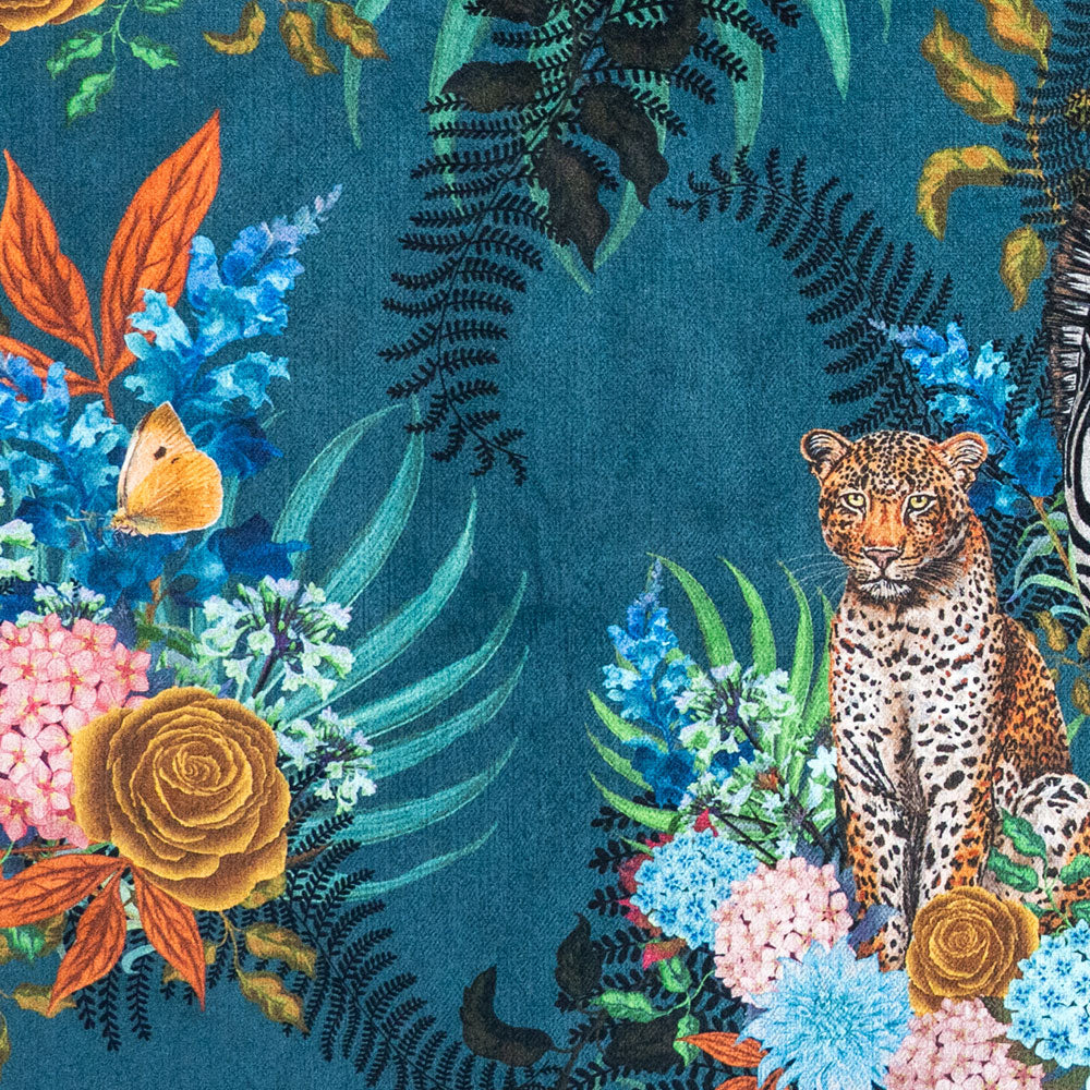 Close-up of the leopard and flowers on Wild Blooms blue patterned velvet upholstery fabric