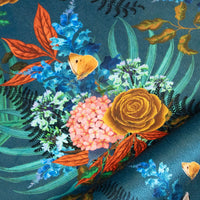 Soft velvet pile and fine print detail of flowers on blue African animal and floral print fabric
