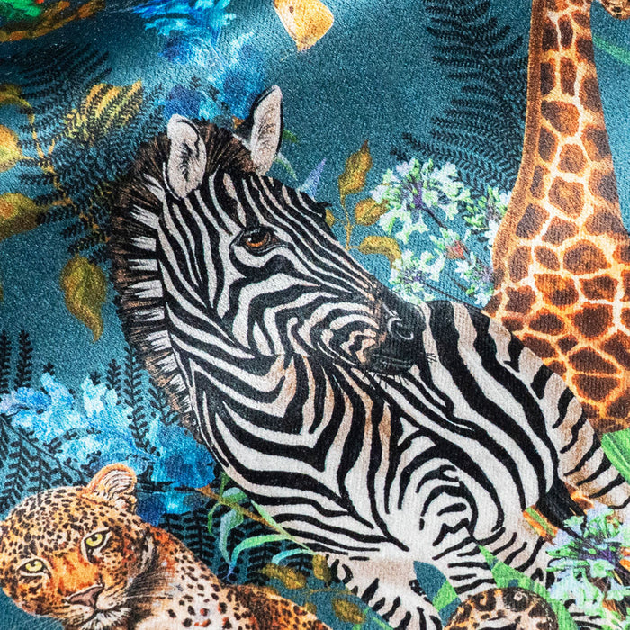 Close-up of zebra on Wild Blooms African animal and floral print velvet fabric in blue
