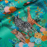 Wild Blooms bright green African animal and floral print designer velvet fabric by Becca Who, with leopards, zebras and giraffes among blooming flowers 