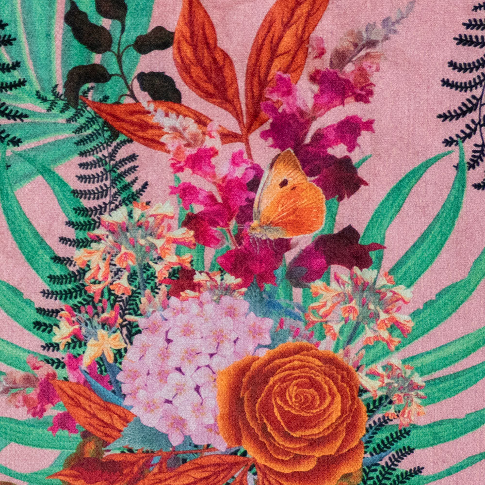 Close-up of flowers and butterfly on Wild Blooms African animal and floral print velvet fabric in pink