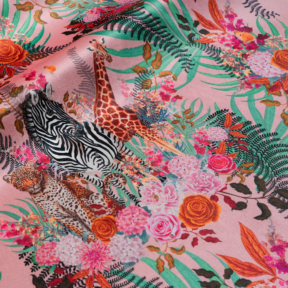 Rippled lengths of Wild Blooms pink African animal and floral print velvet fabric for upholstery and cushions