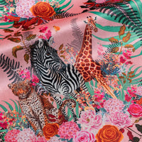 Wild Blooms pink velvet fabric draped in soft folds, showing how the African animal and floral print falls for curtains and blinds