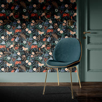 Bengal Rose Garden Wallpaper in colour way fierce by Becca Who shown on wall with Teal chair
