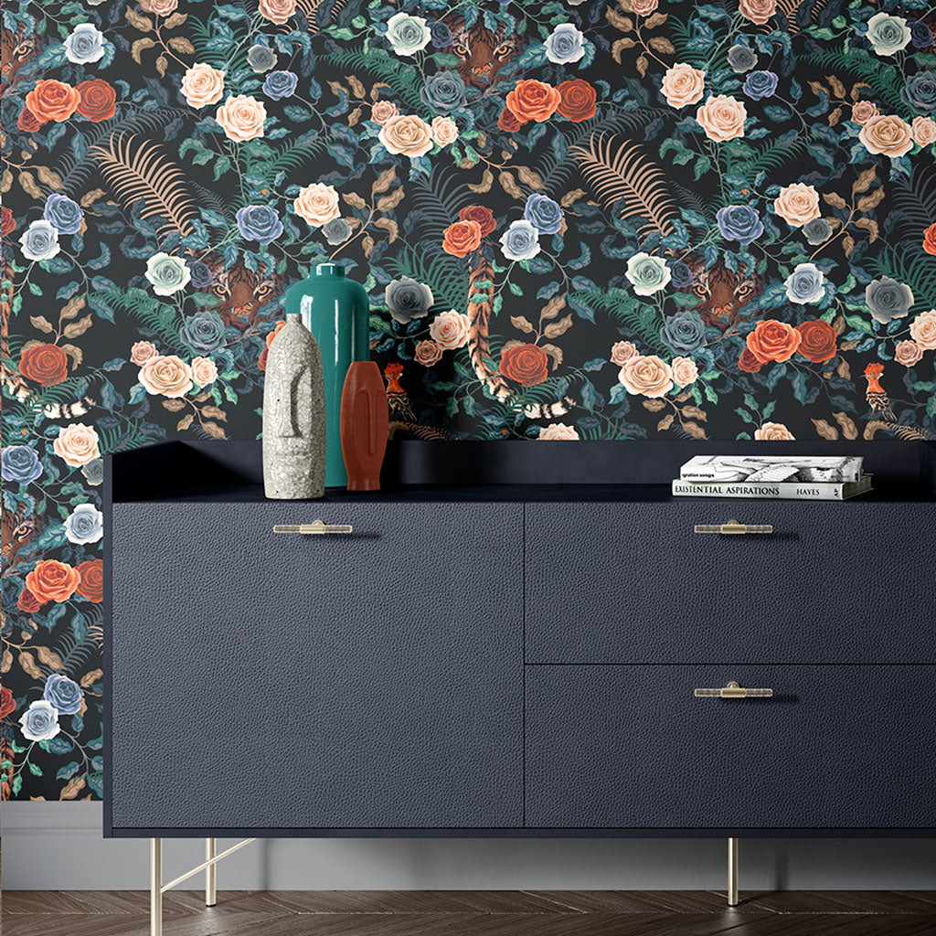 Bengal Rose Garden Wallpaper in colour way fierce by Becca Who shown on wall with Dark Blue sideboard and vases
