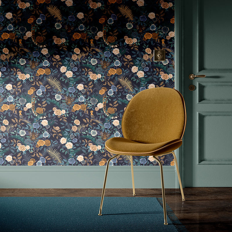 Mustard chair in front of wallpapered wall in dark floral design by Becca Who