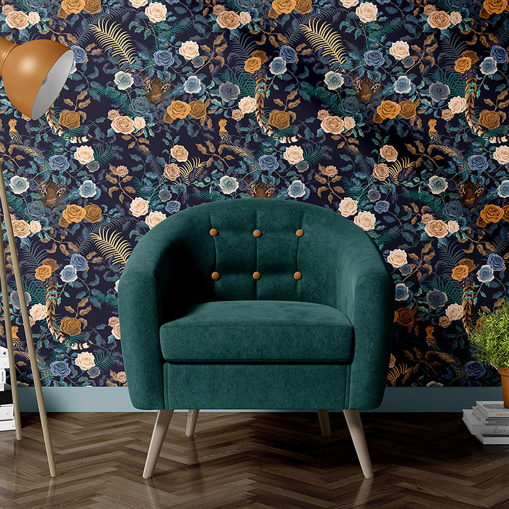 Green tub chair in front of wallpapered wall with dark blue floral design by Becca Who